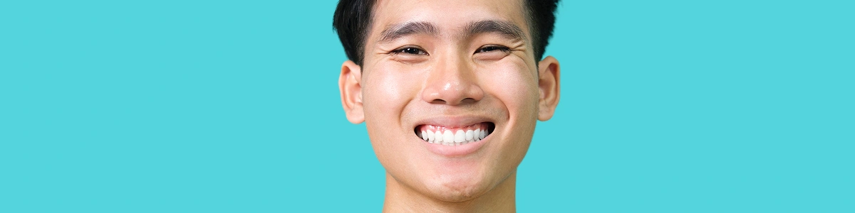 close-up-portrait-of-young-smiling-handsome-gu close up portrait of young smiling handsome gu